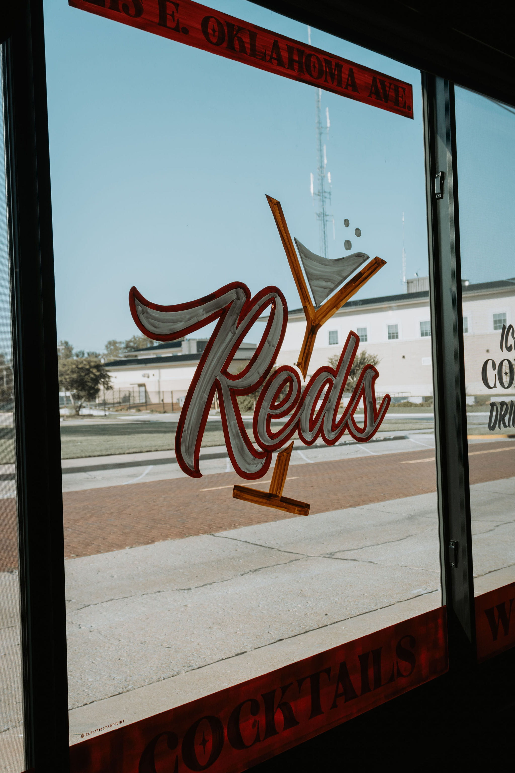 The hand-painted Reds sign in the front window