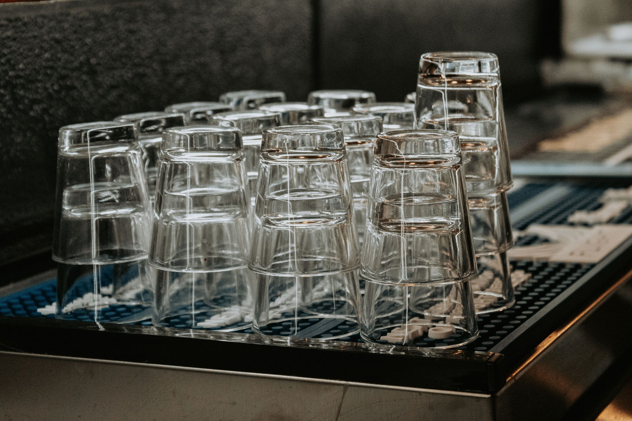 Glassware ready behind the bar at Reds Crafted Cocktails